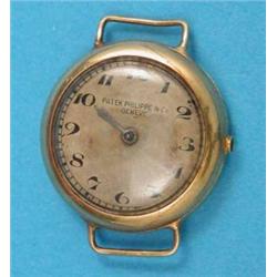 A 1930’s lady’s 18k gold Patek Philippe wrist watch with gilt Arabic dial,...