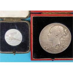 A cased silver aviation medallion, inscribed H.M.A.E.S. July 1931 and a cased silver 55mm diamond...