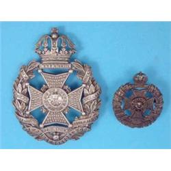 A Victorian white metal The Prince Consort’s Own helmet badge, and a silver Rifle Brigade cap bad...
