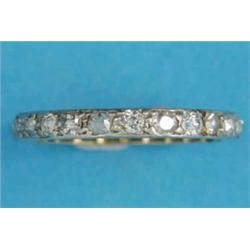 A gold diamond set full eternity ring, size K½...