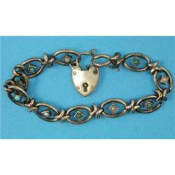 A gold fancy link bracelet, set pearls and turquoises...