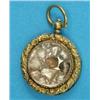 Image 1 : A Victorian gold circular locket, with engine turned and foliate chased decoration containing 11...