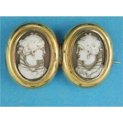 A gold brooch, designed as 2 oval shell cameos carved with female profiles (later bar brooch fitt...