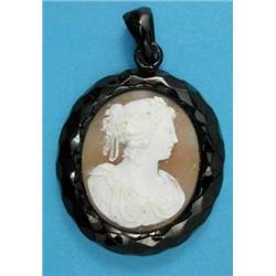 A Victorian shell cameo pendant, carved with a head and shoulder study of a lady, with glazed loc...