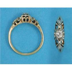 An 18ct gold illusion-set solitaire diamond ring, the shoulders set small diamonds...