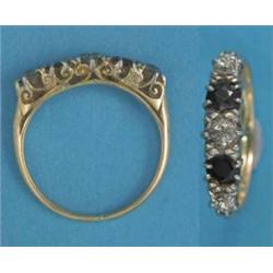 A gold half hoop ring, set 2 sapphires and 3 diamonds...