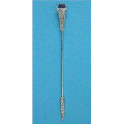 A French Art Deco white metal jabot pin, pave-set with diamonds and a calibre-cut sapphire...