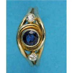 A modern gold ring, collet-set with a sapphire and 2 diamonds...