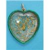 Image 1 : A gold and green enamel heart shape double sided pendant, containing gold nuggets...