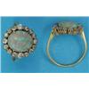 Image 1 : A gold opal and diamond oval cluster ring...