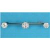 Image 1 : An Edwardian brooch, claw-set with 3 diamonds on a knife edge bar, the centre stone approximately...