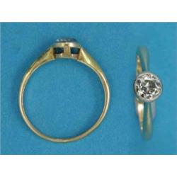 An 18ct gold collet-set solitaire diamond ring...