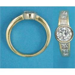 A modern 18ct gold ring, collet-set with a brilliant cut diamond, the tapered shoulders channel-s...