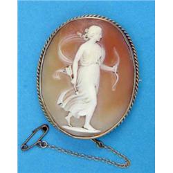 A shell cameo brooch, carved with a classical study of a female figure, in gold ropetwist frame....
