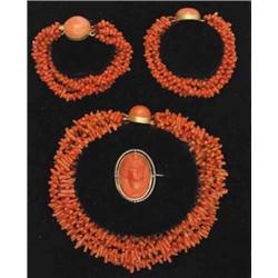 A child’s Victorian demi parure, comprising a 4-row branch coral necklace, a pair of bracelets an...