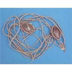 A pair of Georgian gold navette shape bracelet clasps, with glazed hair compartment bordered by a...