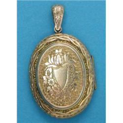 A Victorian gold pendant locket, with foliate engraved decoration...