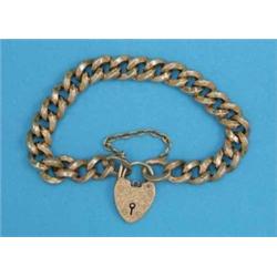 A 9ct gold curblink bracelet, with engraved padlock clasp, 21grms...