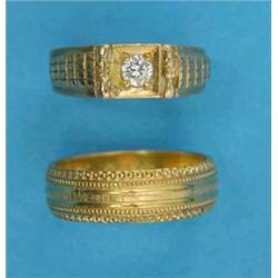 A gentleman’s gold ring, set with a solitaire diamond together with a gold wedding ring...
