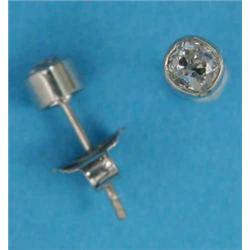 A pair of solitaire diamond earstuds, collet-set in white metal...