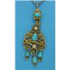Image 1 : An Eastern gold filigree work pendant, set turquoises and split pearls, supporting 3 matching dro...