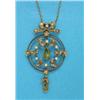 Image 1 : An Edwardian 15ct gold circular openwork pendant, with tied ribbon surmount set seed pearls and p...