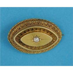 A Victorian bloomed gold navette shape brooch, with wirework decoration, gypsy set with a diamond...