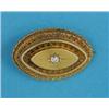 Image 1 : A Victorian bloomed gold navette shape brooch, with wirework decoration, gypsy set with a diamond...