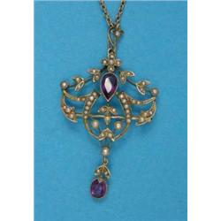 An Edwardian gold openwork pendant, millegrain set 2 amethysts and seed pearls, on tracelink chai...