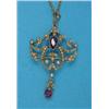 Image 1 : An Edwardian gold openwork pendant, millegrain set 2 amethysts and seed pearls, on tracelink chai...