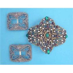 A pair of French cut steel buckles, and a pierced work buckle set pastes...