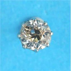 A single diamond earstud, the old brilliant cut stone claw-set in gold...