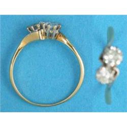 A gold 2-stone diamond crossover ring...