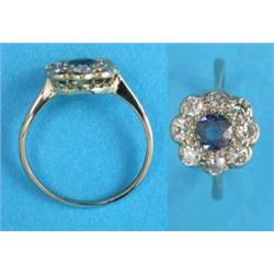 An 18ct white gold sapphire and diamond circular cluster ring...
