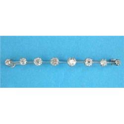 A white gold bar brooch, claw-set with 8 graduated old brilliant cut diamonds on a knife edge sup...
