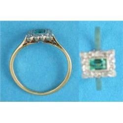 A gold emerald and diamond rectangular cluster ring...