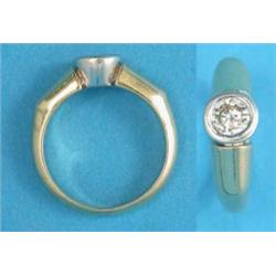A modern gold ring, collet set with a brilliant cut diamond, the shank stamped 750...