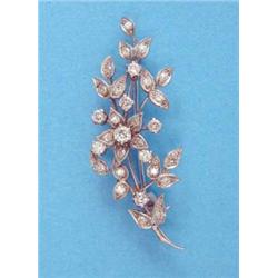 A white gold diamond set floral spray brooch...