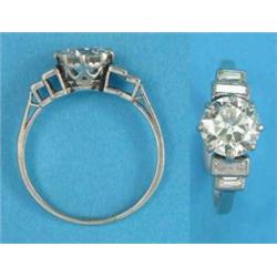 A platinum solitaire diamond ring, the claw-set brilliant cut stone approximately 1.4cts, the sho...