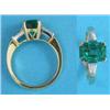 Image 1 : A gold emerald and diamond ring, the claw-set rectangular cut emerald flanked by tapered baguette...