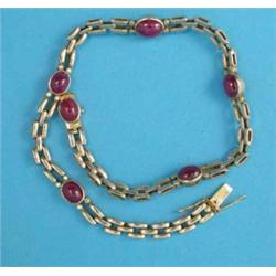 A gold rectangular link necklace, set 6 cabochon oval rubies, each flanked by 4 small diamonds 14...