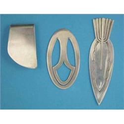 Two Georg Jensen silver book marks and a money clip...