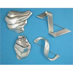 A Georg Jensen brooch, No.395, another No.396, and 2 other brooches...