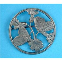 A Georg Jensen circular openwork brooch, worked butterflies and flowers, No.283...