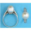 Image 1 : A white gold ring, set with a single pearl, the tapered shoulders set diamonds...