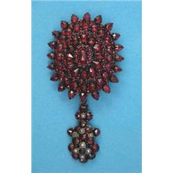 A Victorian garnet set brooch, with detachable drop set garnets and seed pearls...