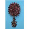 Image 1 : A Victorian garnet set brooch, with detachable drop set garnets and seed pearls...