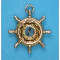 A Victorian gold ‘ships wheel’ fob compass...