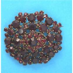 A Victorian gold garnet set brooch...