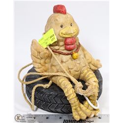 HANGING CHICKEN SITTING ON TIRE GARDEN